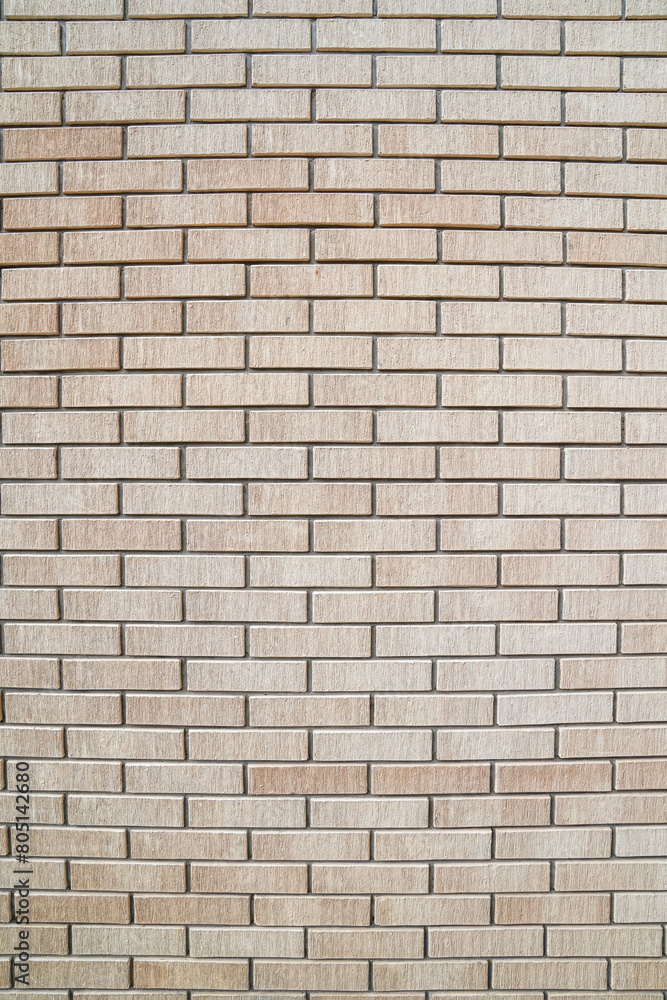 Vertical yellow and textured brick wall background Vertical yellow and textured brick wall background