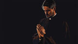 Handsome praying priest on dark background Vector style