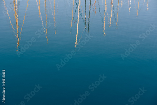Obraz na plátně Summer image of sailing boats colorful masts reflected on sea water