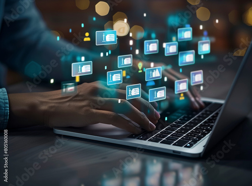 A businessman's hands working on a laptop with a digital document management system concept, using a computer for virtual documents and company information, displaying multiple financial file icons in