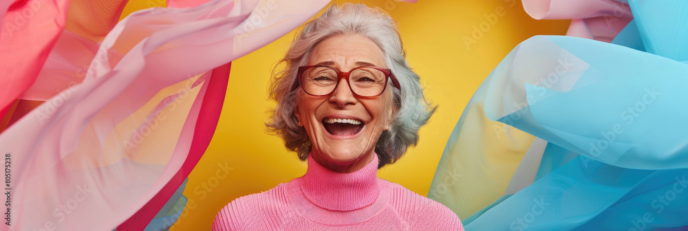 Fototapeta premium An older woman wearing glasses and a pink sweater