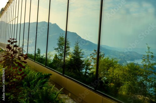 Wallpaper Mural Hotel Five Stars Bürgenstock with Glass Wall with reflection over Lake Lucerne and Mountain in Sunny Day in Bürgenstock, Nidwalden, Switzerland. Torontodigital.ca