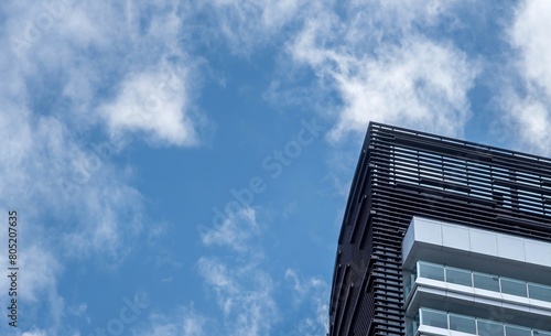 A corner of a building under the blue sky