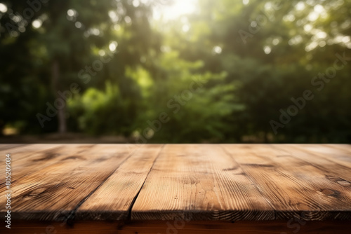 Wooden tabletop  Empty copy space surface made of natural boards. Green trees in the background.