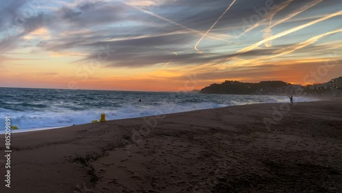 Sunset on a sea beach in Lloret de Mar. Catalonia, Spain