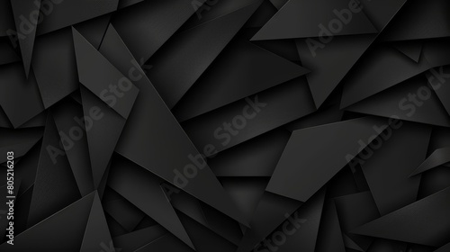   A black background filled with various black and white shapes in differing sizes photo