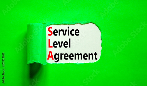 SLA service level agreement symbol. Concept words SLA service level agreement on beautiful white paper. Beautiful green paper background. Business SLA service level agreement concept. Copy space.