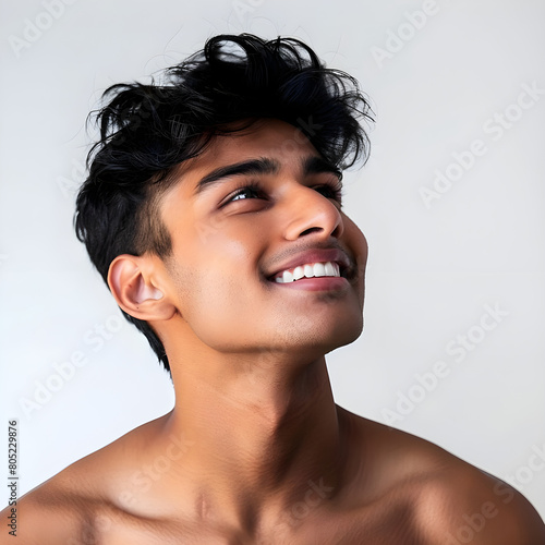 Beautiful young indian man with clean fresh skin, Model with healthy and shiny skin, close up portrait, beauty and spa.