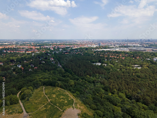 Aerial landscape of Grunewald forest and city skyline on a sunny day in Berlin photo