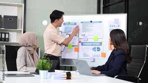 Wallpaper Mural Group of young business people discussing business plan at modern startup in creative business discussing work Torontodigital.ca