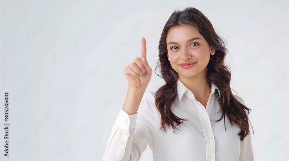 smiling pretty well-groomed young woman showing index finger up, isolated on white background, empty copy space smiling pretty well-groomed young woman showing index finger up, isolated on white background, empty copy space