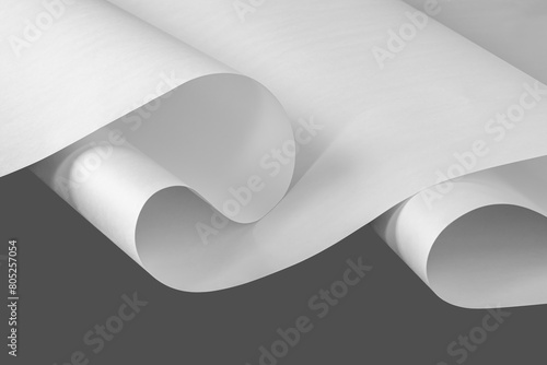 A large unfolded sheet of white paper in black and white.