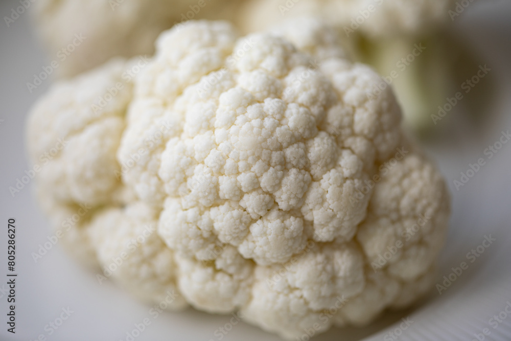 Close-up of a cauliflower. Chopped cauliflower. Healthy eating. Close up food photography. Fresh cauliflower. Close-up of a cauliflower. Chopped cauliflower. Healthy eating. Close up food photography. Fresh cauliflower.