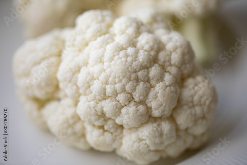 Close-up of a cauliflower. Chopped cauliflower. Healthy eating. Close up food photography. Fresh cauliflower.