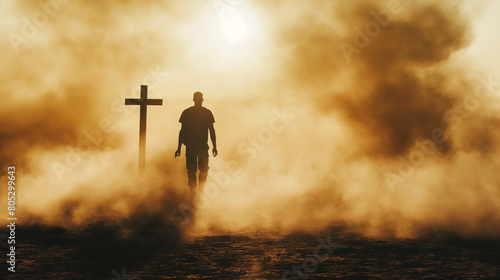 Silhouette of a man in the desert with a cross in the smoke and dust under light the sun, religion concept. 
 photo