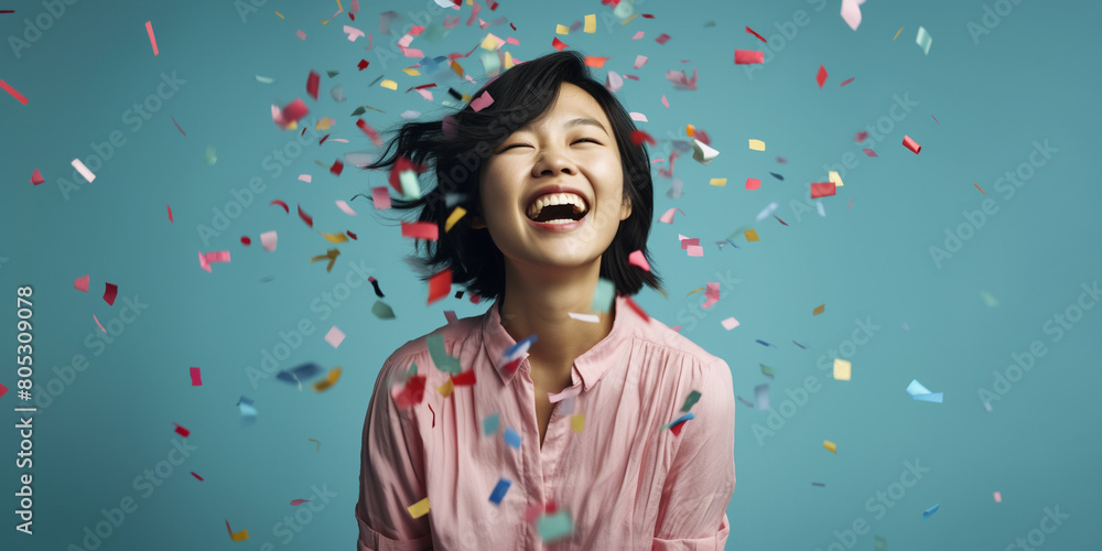 asian woman, smiling portrait, on sky blue background, colorful confettie falls asian woman, smiling portrait, on sky blue background, colorful confettie falls