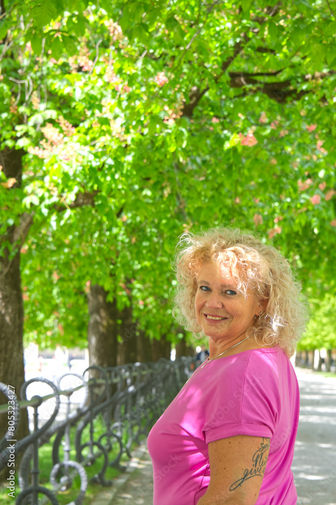 Portrait of a middle aged european woman in a park