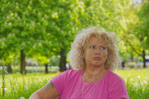 Portrait of a middle aged european woman in a park