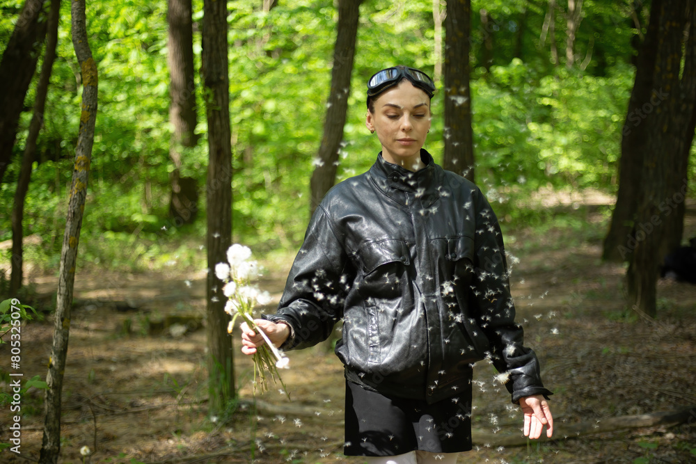 Girl Walking Through Forest Holding Dandelions