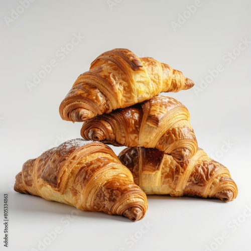 A pile of delectable croissants stacked one on top of the other