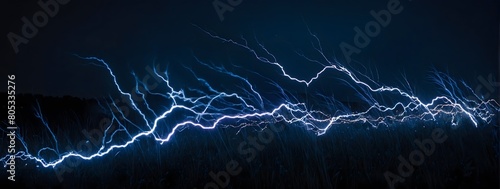 Indigo lightning dances in the blackness, adding a mystical touch to the nocturnal scene. photo