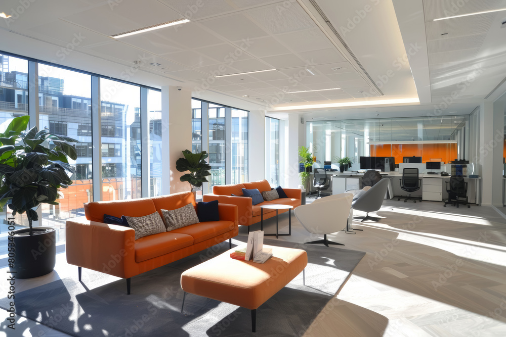 Modern office interior with orange sofas and green plants. Professional workplace design. Corporate office setup concept for design and print. Interior shot with natural light Modern office interior with orange sofas and green plants. Professional workplace design. Corporate office setup concept for design and print. Interior shot with natural light