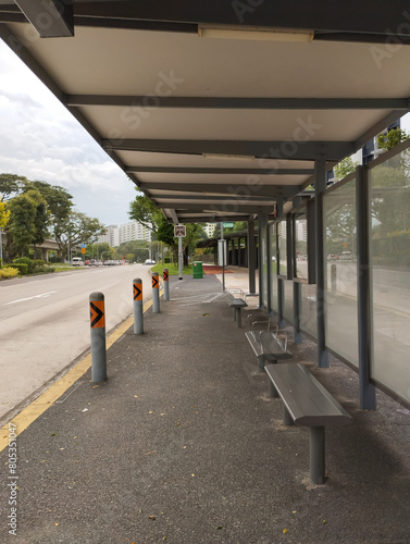 wide and long but empty bus stop during the day