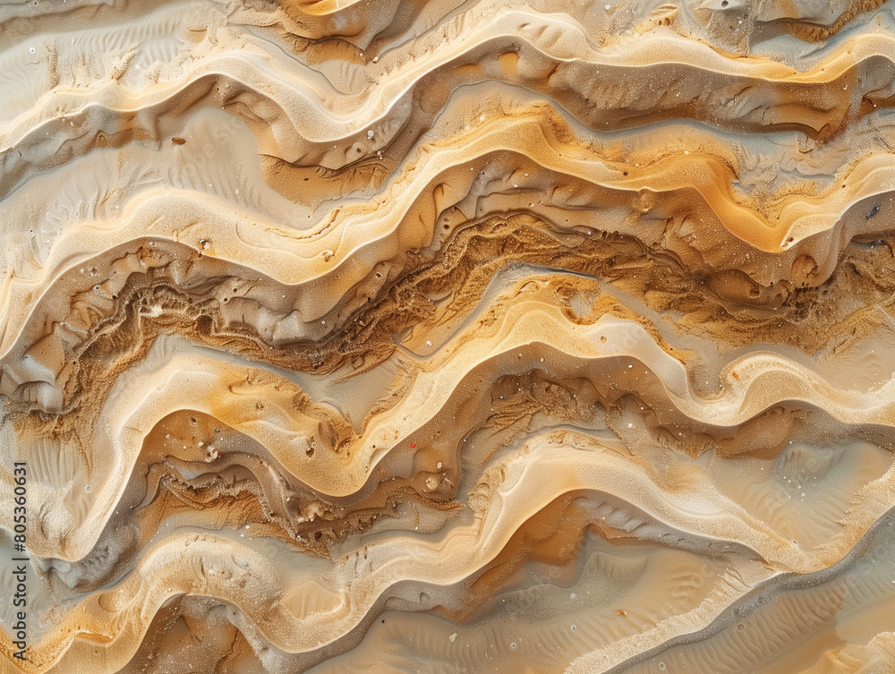 Texture de sable sur une plage, façonnée par le vent et l'eau, ondulante. Texture de sable sur une plage, façonnée par le vent et l'eau, ondulante.