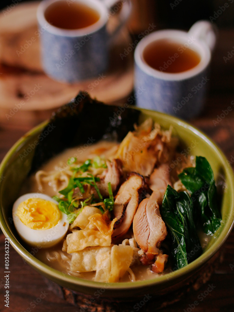 Toripaitan ramen in a bowl, with egg, vegetable, grilled chicken and nori
