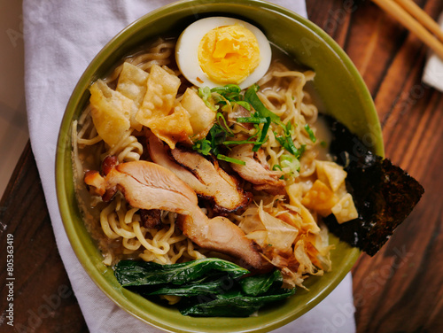 Toripaitan ramen in a bowl, with egg, vegetable, grilled chicken and nori