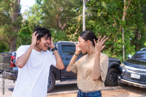 Car insurance concept. Two Drivers Arguing after car hit from behind after traffic accident. Two cars damaged after head-on collision, car crash. Car crash on the street, damaged cars after collision.