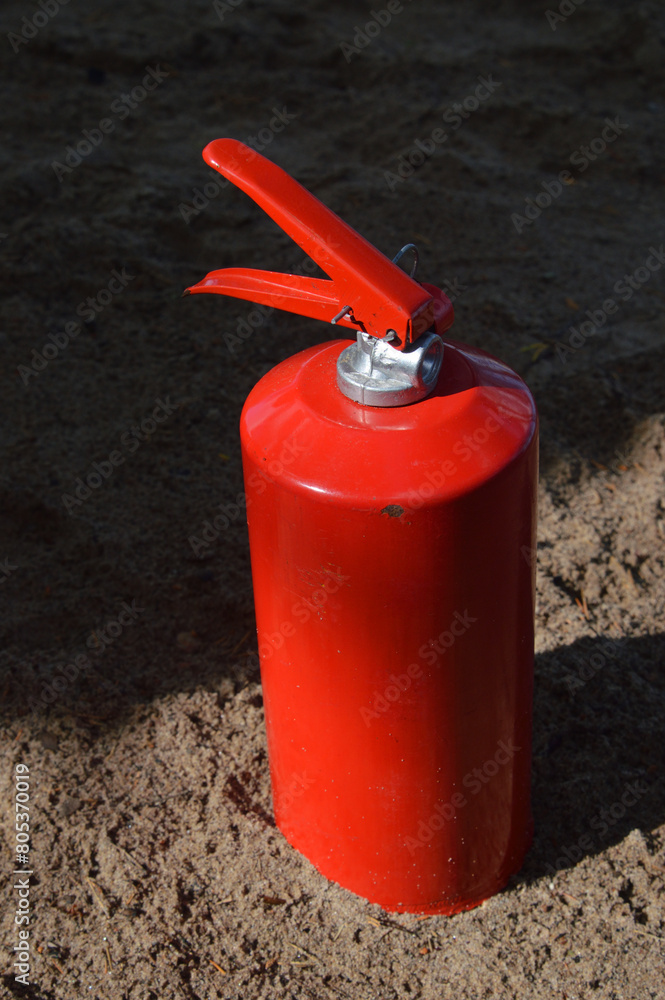 Obraz premium Red fire extinguisher.
