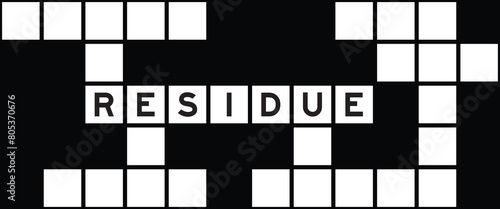 Alphabet letter in word residue on crossword puzzle background