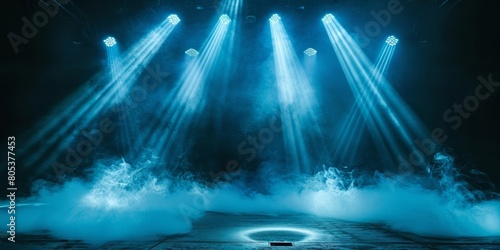 Blue stage lights illuminate an empty stage with smoke.