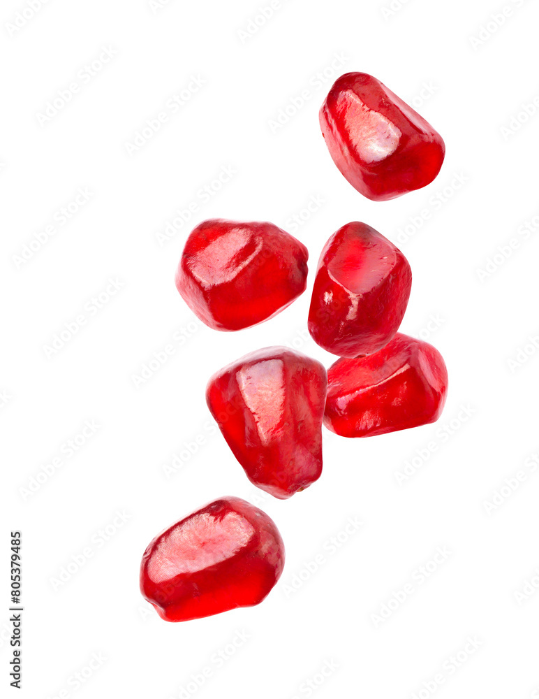 Ripe Pomegranate seeds falling isolated on white background. Ripe Pomegranate seeds falling isolated on white background.
