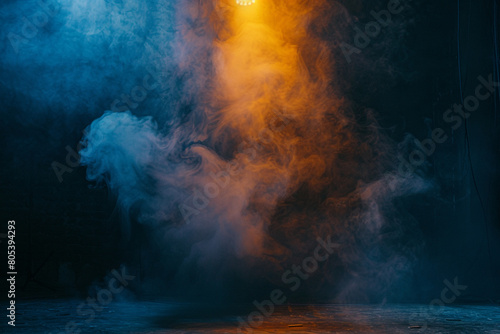 A stage enveloped in rich navy smoke under a golden yellow spotlight, casting a deep, mysterious glow.