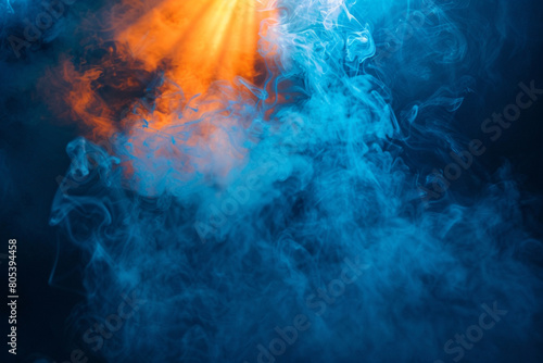 A stage filled with icy blue smoke under a bright orange spotlight, providing a cool, invigorating look against a black background. photo