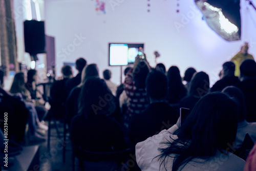 Wallpaper Mural A training room with a large number of people. An auditorium or a conference room. A rear view of unfamiliar participants in the audience. Scientific conference, training. High quality photo Torontodigital.ca