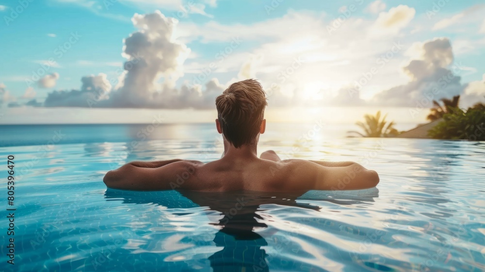 Luxury Resort. Man Relaxing In Infinity Swimming Pool Water. Beautiful Happy Healthy Male Model Enjoying Summer Travel Vacation At Tropical Spa Hotel In Indonesia, Sea View. Summertime Relax Concept Luxury Resort. Man Relaxing In Infinity Swimming Pool Water. Beautiful Happy Healthy Male Model Enjoying Summer Travel Vacation At Tropical Spa Hotel In Indonesia, Sea View. Summertime Relax Concept