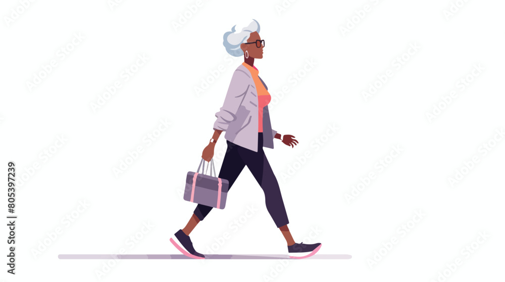 Senior gray-haired woman walking in modern casual c