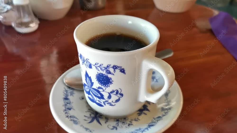Blue white cup pot with black coffee wooden table Mexico. Blue white cup pot with black coffee wooden table Mexico.