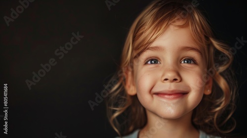 A smiling little girl captivates with her happiness
