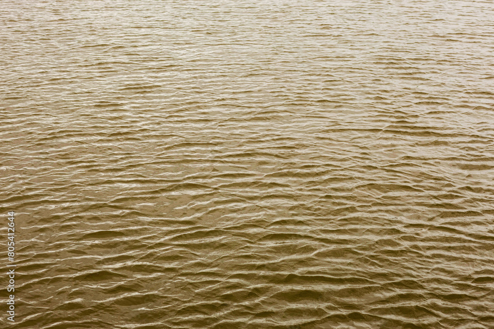 the surface of the water, taken on a cloudy windy evening the surface of the water, taken on a cloudy windy evening