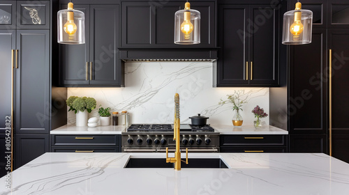 A kitchen with a white countertop and black cabinets photo