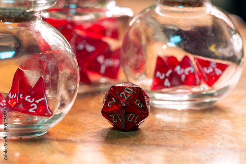 A Single Red Dice Stands Out Beside Glass Jars