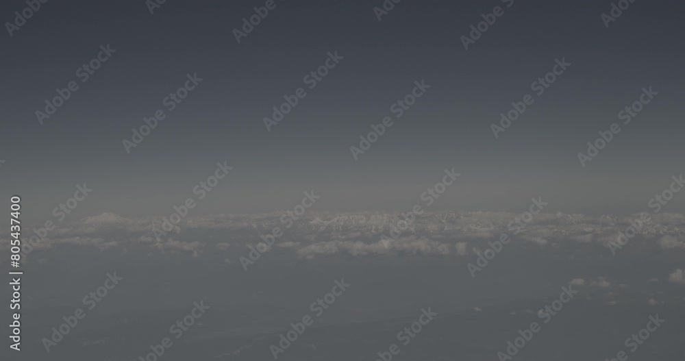View From Airplane Window On Snow-capped Peaks Of Mount Elbrus And Main Caucasian Range. Travel And Tourism Around World. Elbrus Is Highest Mountain In Europe. Mountains range. Caucasus. Ungraded C View From Airplane Window On Snow-capped Peaks Of Mount Elbrus And Main Caucasian Range. Travel And Tourism Around World. Elbrus Is Highest Mountain In Europe. Mountains range. Caucasus. Ungraded C