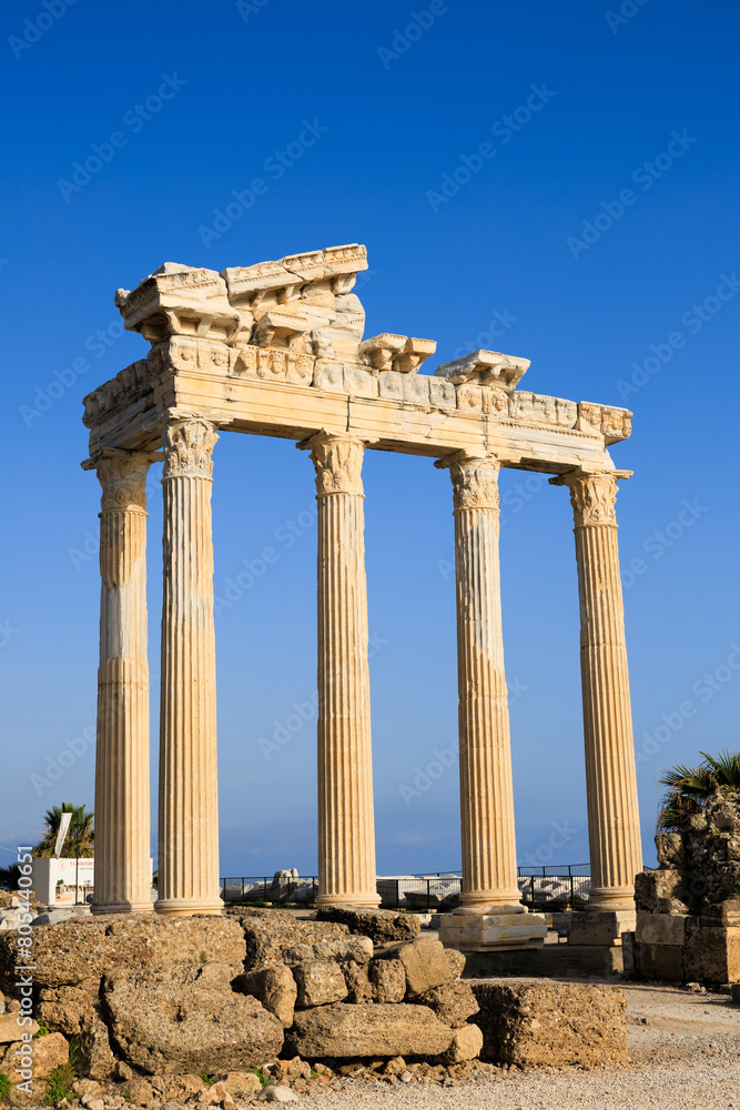 Amidst Side's ancient ruins, the Temple of Apollo's columns rise, echoing the grandeur of a bygone civilization.
