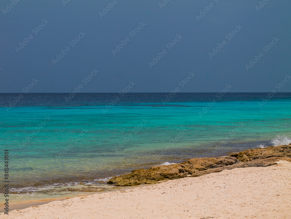 Tropical beach with turquoise water and white sand in Curaçao