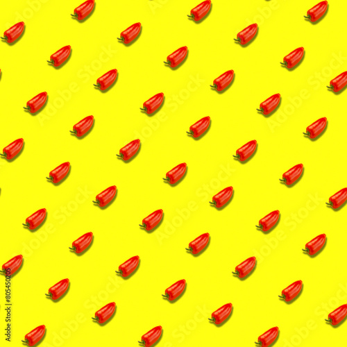 Abstract pattern from red bell pepper on a yellow background.