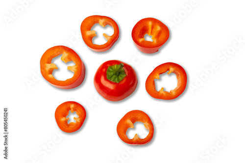 Set of fresh whole and sliced sweet red pepper isolated on white background. Top view.